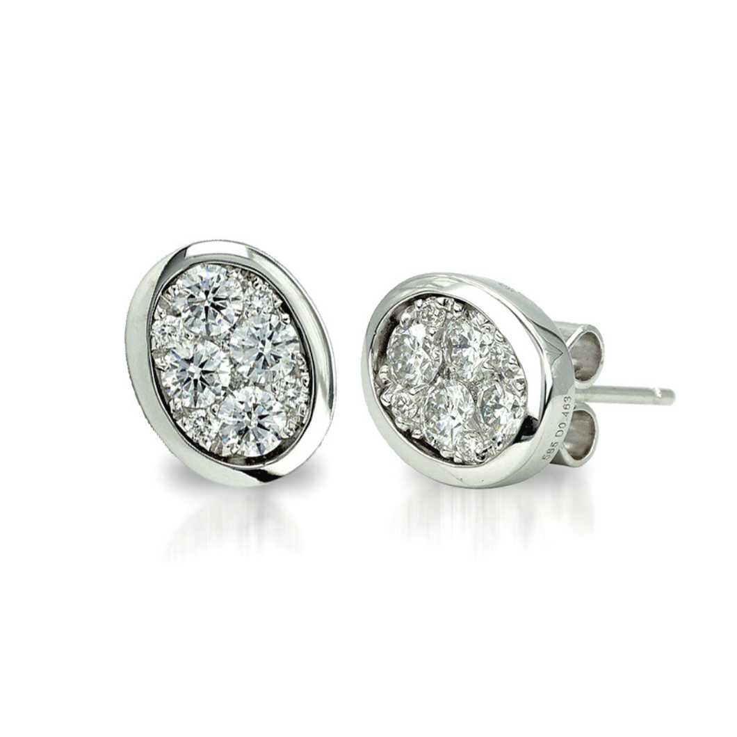 The Oval-Shape bezel Set Illusion Stud Earrings are crafted with 14K white gold that features 8 pieces of 0.83-carat diamonds in total weight and 12 pieces of .10-total carats with a clarity grading of VS-SI1 s and in the colors F to G.  Inclusive of My Diamond Jewelry Box and Jewelry Certificate