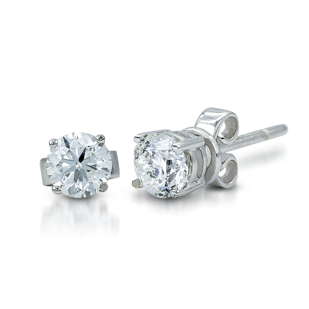 The Solitaire Round Brilliant Stud Earrings is crafted in 14K White Gold and each piece features a single round brilliant diamond --one piece (4.6x4.6x2.9mm) in the clarity grading IF with the color J; and the other (4.6x4.6x3mm) in the clarity grading VVS1 with the color J.  The total carat weight of both is 0.8-ctw. 